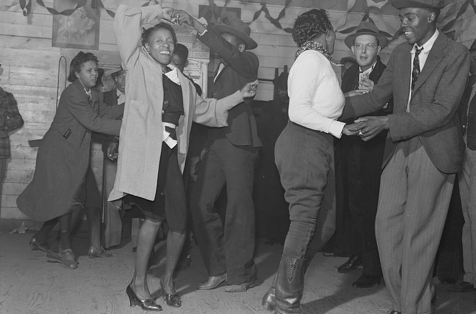 Several people dancing in a Black juke joint on Saturday evening outside Clarksdale, Mississippi Delta